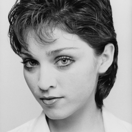 mr mrs madonna, Headshot of American pop singer Madonna wearing an open-necked blouse with short, dark hair, New York City, Spring 1979. 