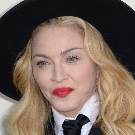 mr mrs madonna,  Madonna poses on the red carpet during the 56th Grammy Awards at the Staples Center in Los Angeles, California, January 26, 2014.